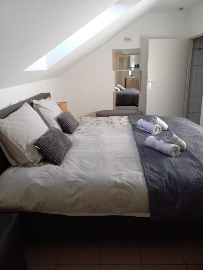 De achtertuin Appartement Maasmechelen Buitenkant foto